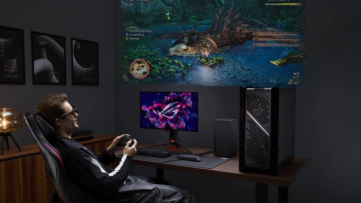 ASUS ROG gaming setup: seated player with a controller facing a wall-size game projection, monitor and tower on the desk