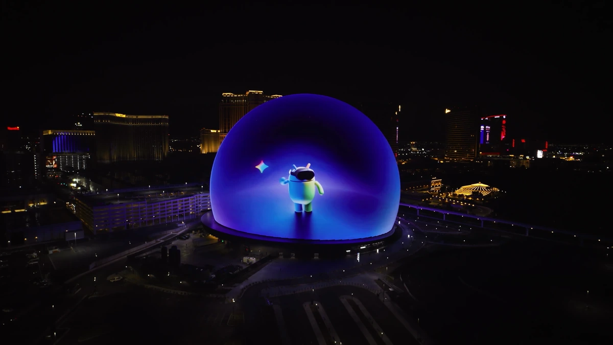 Android XR mascot displayed on the illuminated Sphere in Las Vegas at night with the city skyline behind