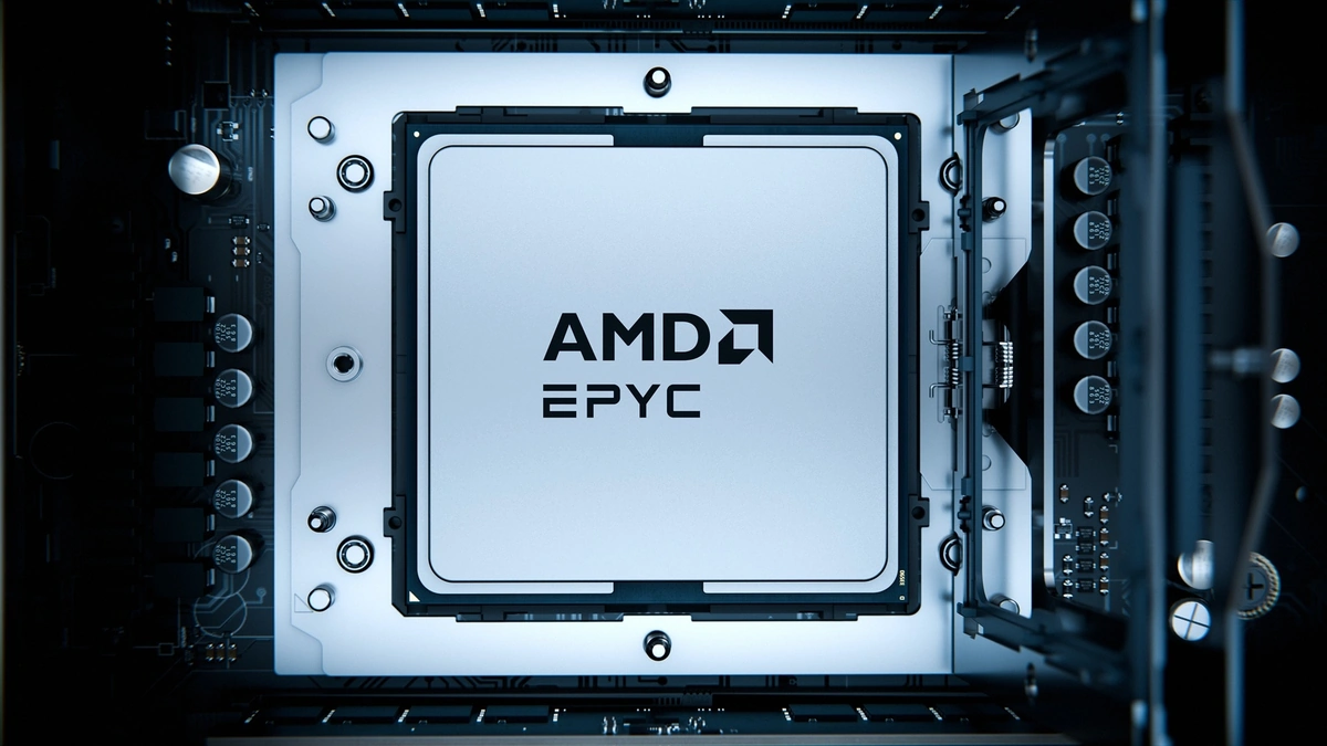 AMD EPYC 9006 Series processor seated in its socket on a dark motherboard, seen from above with capacitors beside it