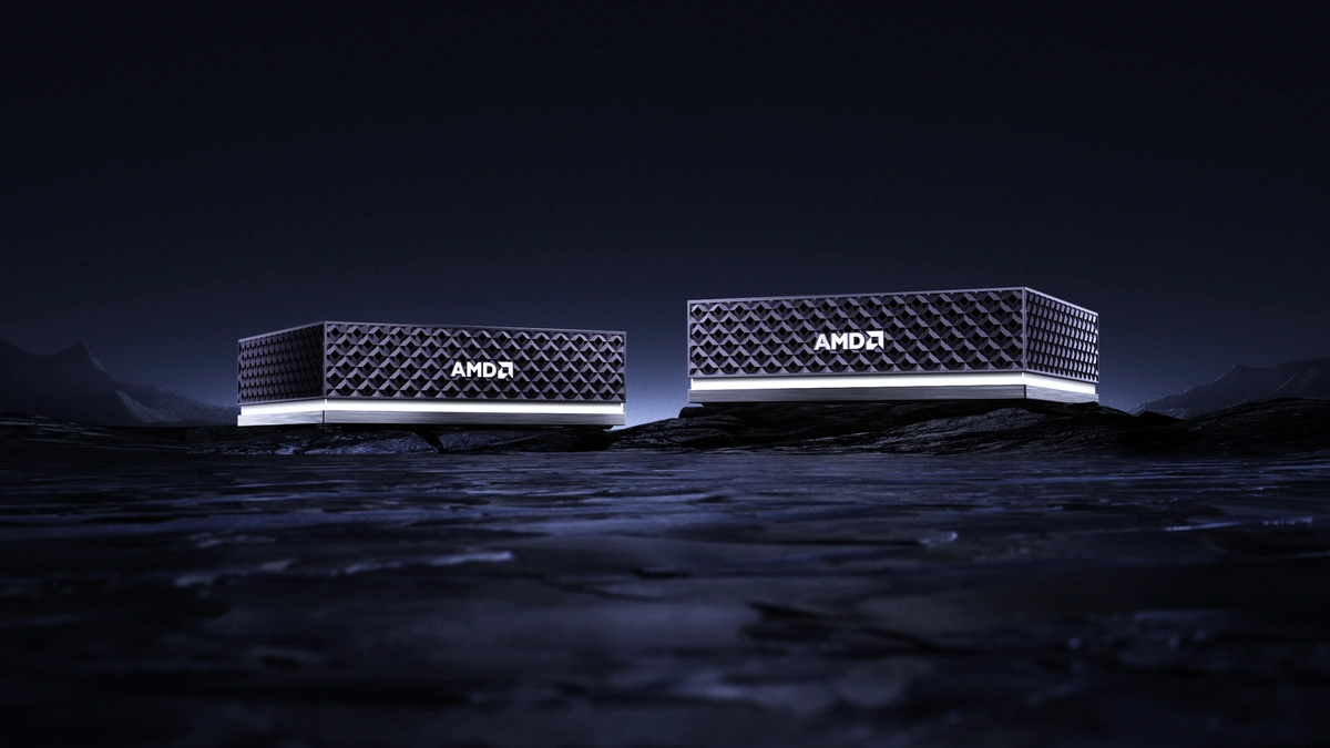 AMD Ryzen AI Halo developer platform units with a diamond-mesh casing on a dark rocky surface