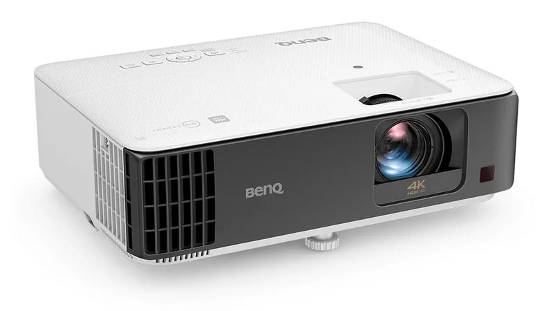 BenQ TK700STi 4K projector in white and black seen at an angle on a white background