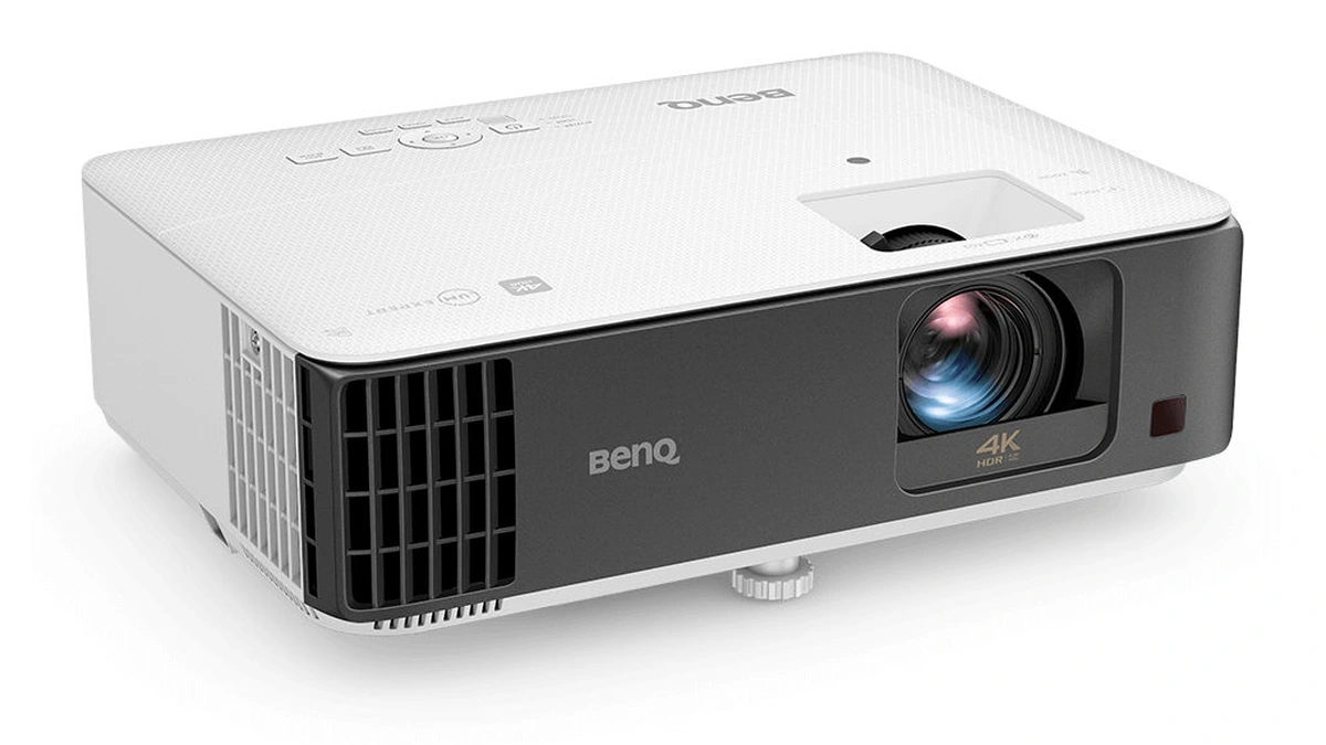 BenQ TK700STi 4K projector in white and black seen at an angle on a white background