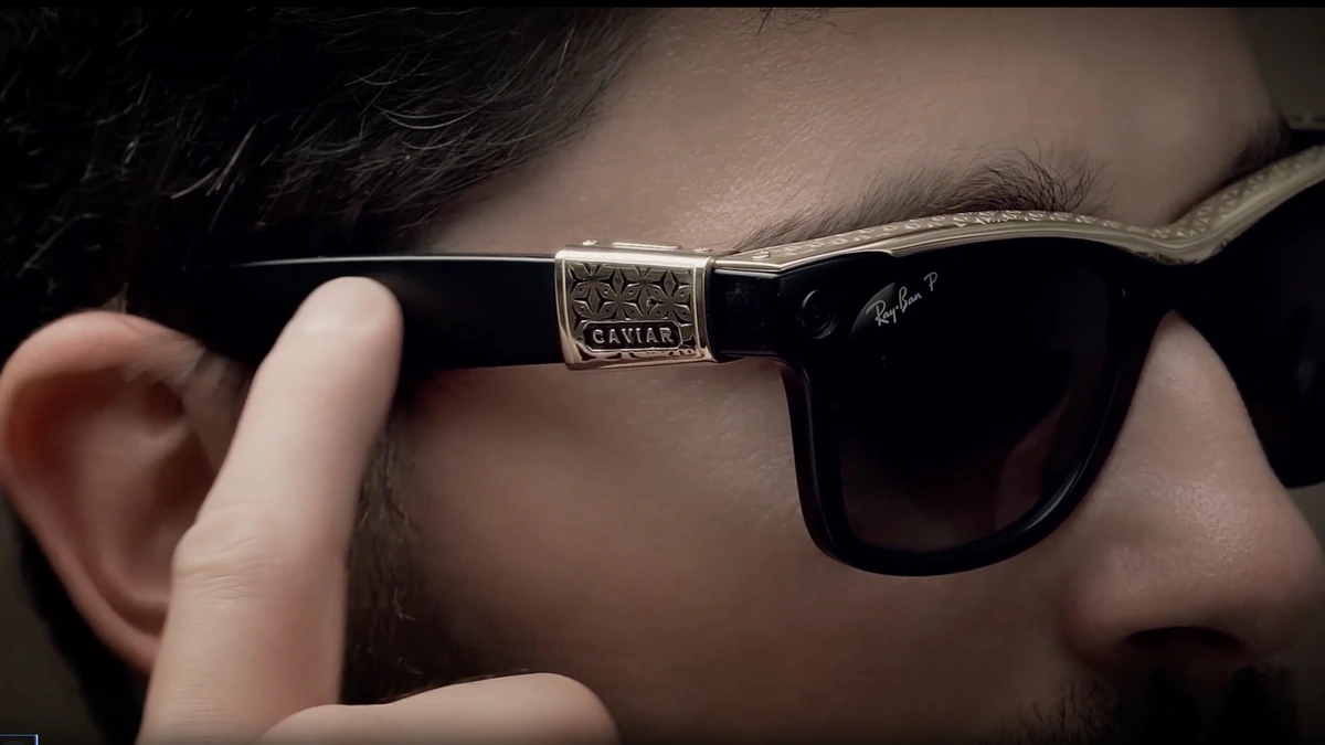 Close-up of the engraved 24K gold temple piece on Caviar's Odyssey Ray-Ban smart glasses