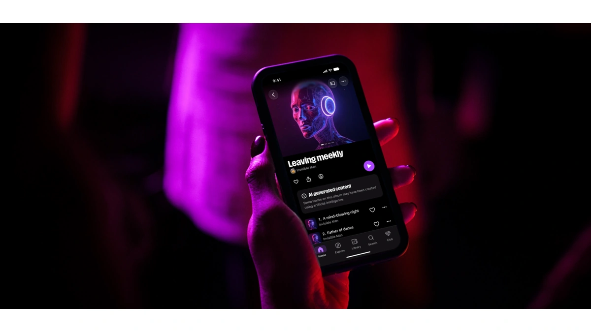 Hand holding a phone with a Deezer album page that shows an AI-generated content label, lit in purple and red