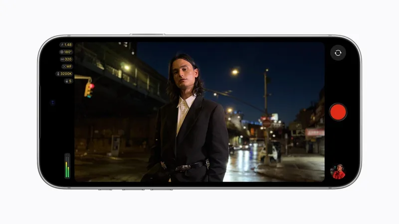 Final Cut Camera on an iPhone held in landscape showing a person in a dark jacket on a night street