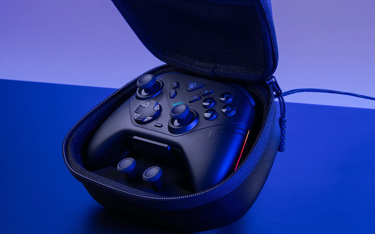 Carry case shows the ASUS ROG Raikiri II controller, a stick drift alternative, on a blue-lit surface