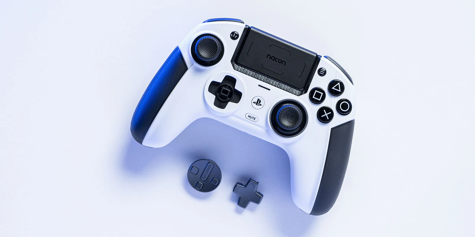 Stick drift fix example: the white Nacon Revolution 5 Pro shows a swappable thumbstick and D-pad beside it