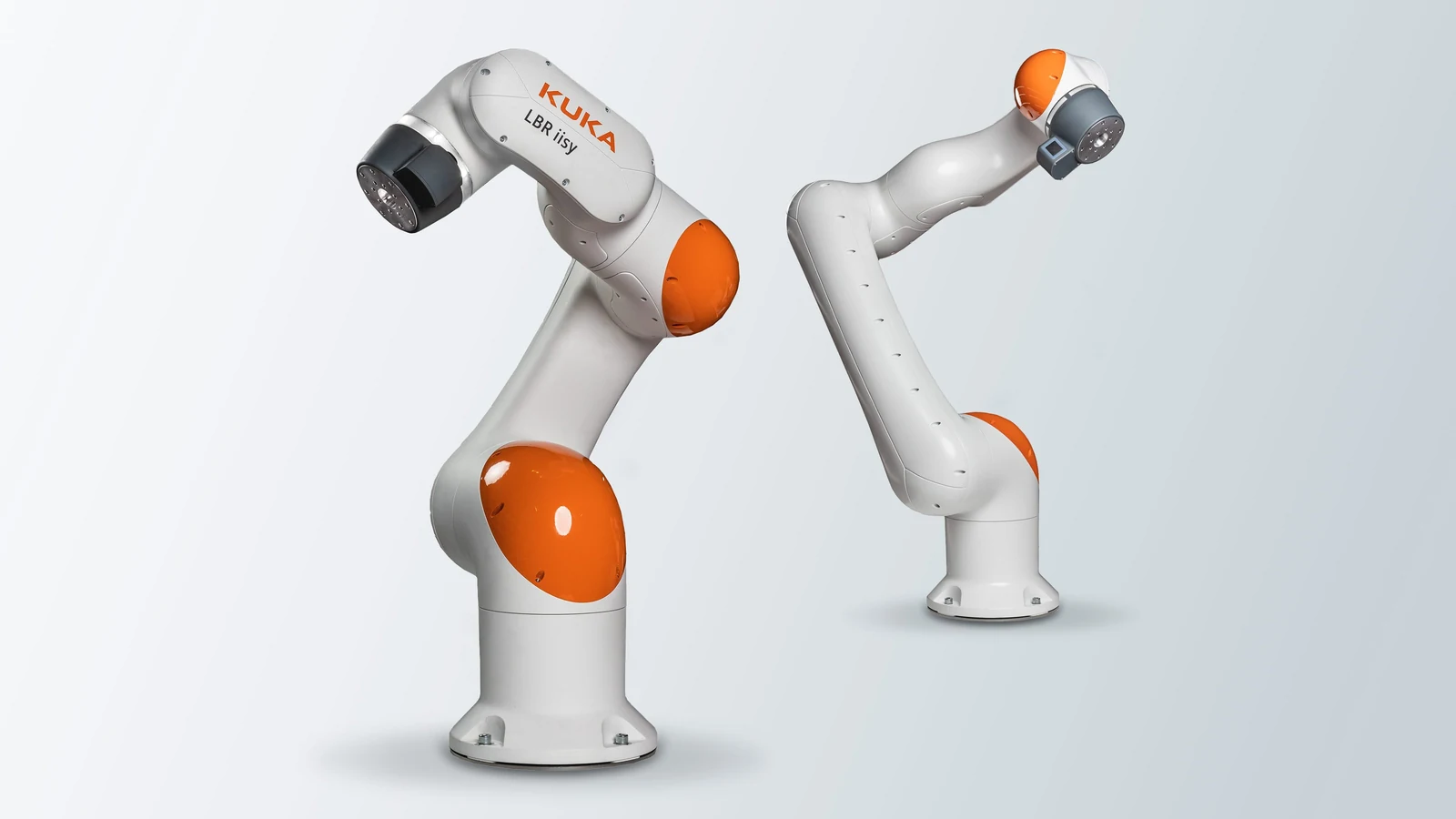KUKA LBR iisy collaborative industrial robot arms show white and orange joints on a light background
