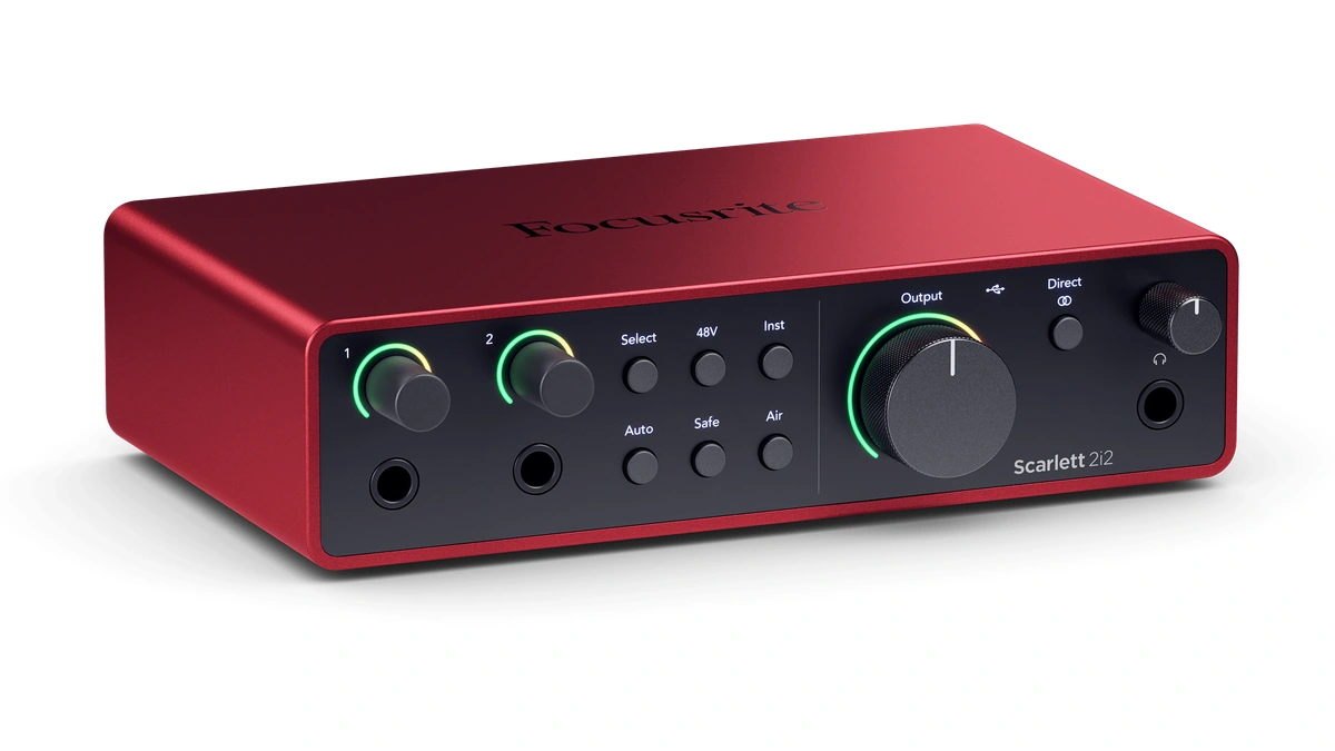 Focusrite Scarlett 2i2 audio interface with two inputs, green-lit gain rings and a large output knob