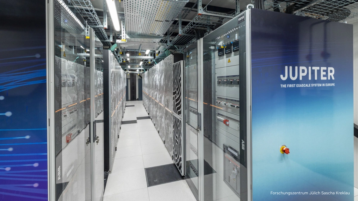 JUPITER exascale supercomputer racks in a Jülich hall with the JUPITER name on a cabinet