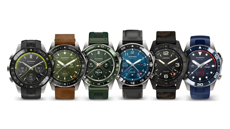 Six Garmin MARQ (Gen 3) watches in a row with rubber, leather and fabric bands and different dial faces on a white background