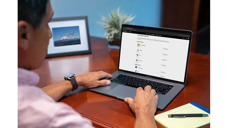 Pilot at a laptop viewing flyGarmin.com flight log sharing, with Class A and Coflyt listed as connected providers