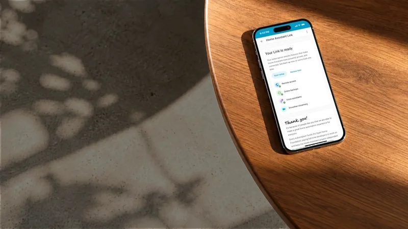 Home Assistant Link ready screen on a smartphone lying on a sunlit wooden table