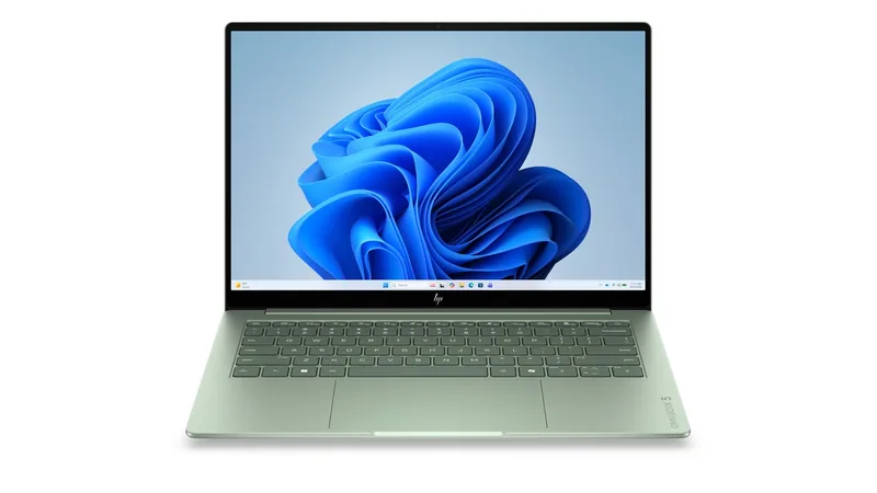 HP OmniBook 5 laptop in pale green, open and facing front, with the Windows desktop on screen