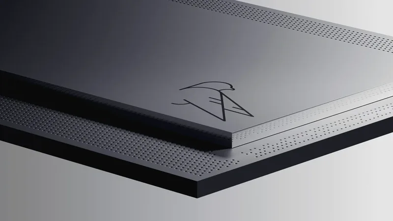 Close-up of the IBM Quantum Nighthawk processor lid, a dark perforated panel engraved with a hawk emblem