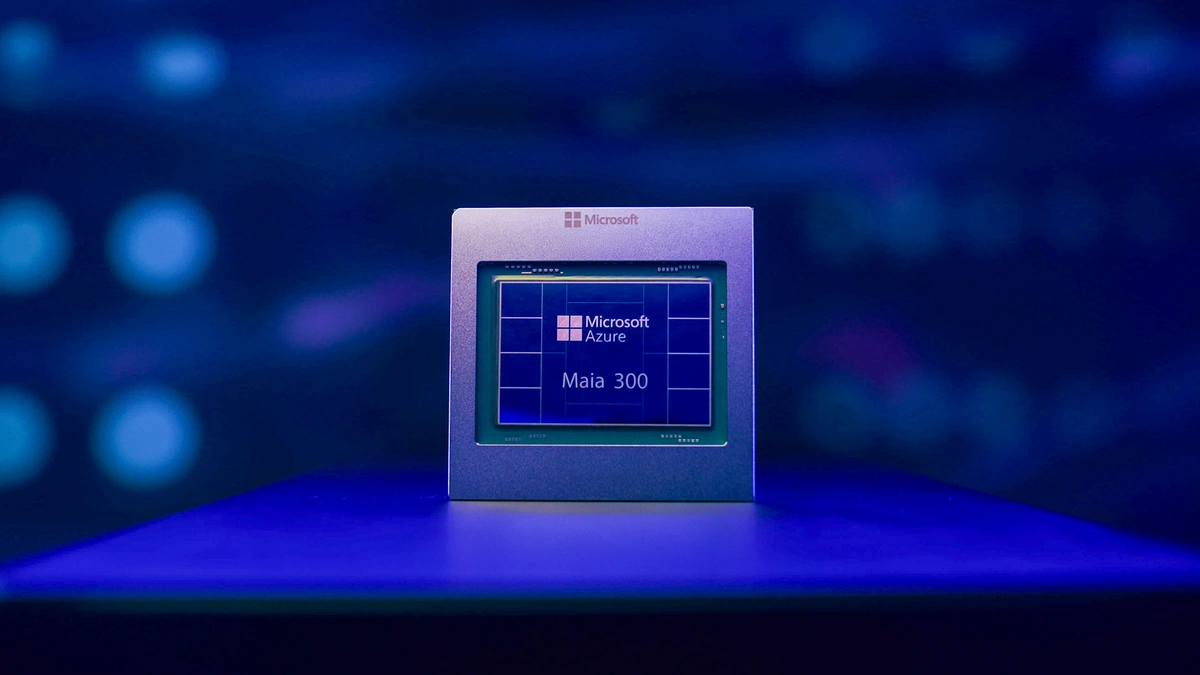 Maia 300 chip in a silver package on a dark stage under blue light