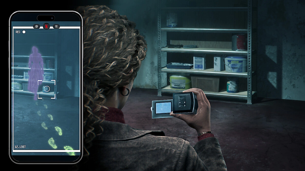 The Conjuring: Unspoken scene of a woman filming a basement with a camcorder while a phone screen shows a ghost