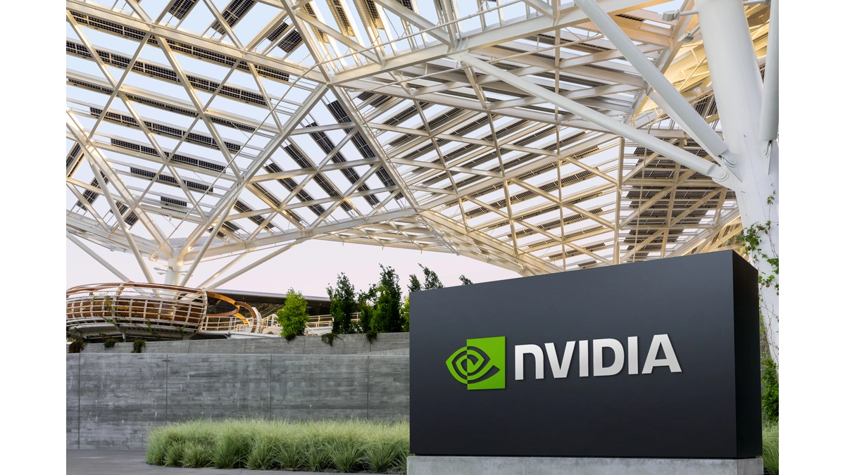 NVIDIA logo sign beneath a steel lattice canopy with solar panels on a corporate campus