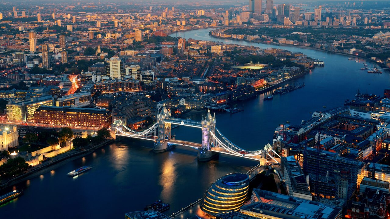 Aerial view of London at dusk with Tower Bridge over the River Thames