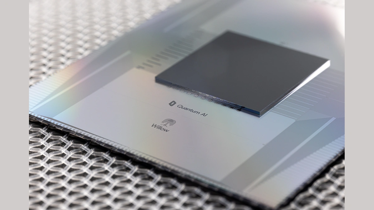 Close-up of a Quantum AI chip labeled "Quantum AI" and "Willow" on a patterned surface.