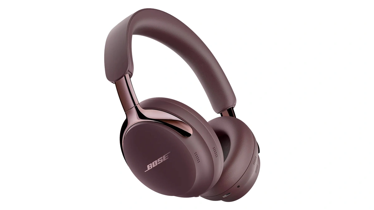 Bose QuietComfort Ultra Headphones (2nd Gen) in a burgundy finish seen at an angle on a white background
