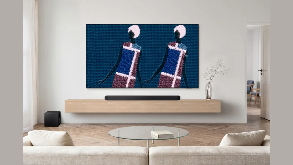 Samsung The Frame displaying a colorful abstract artwork in a bright modern living room