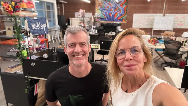 Stone Kite studio photo of two smiling people in a creative office