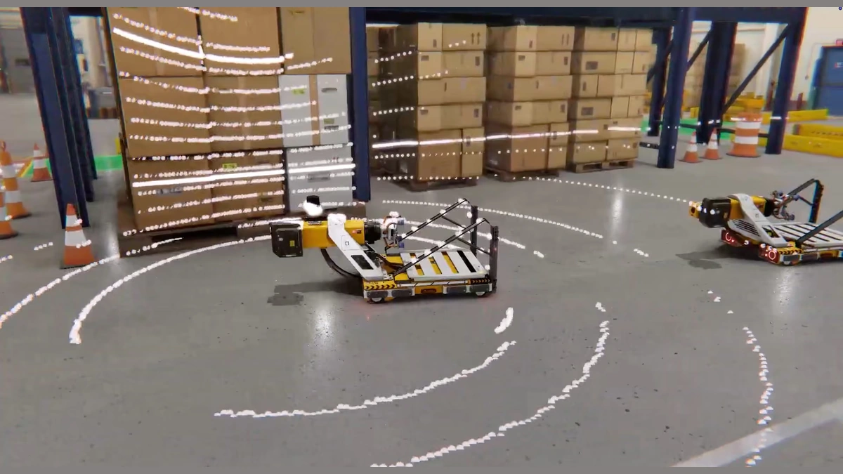 Unity Simulation Pro scene of autonomous mobile robots on a warehouse floor among stacked boxes, pallets and orange cones