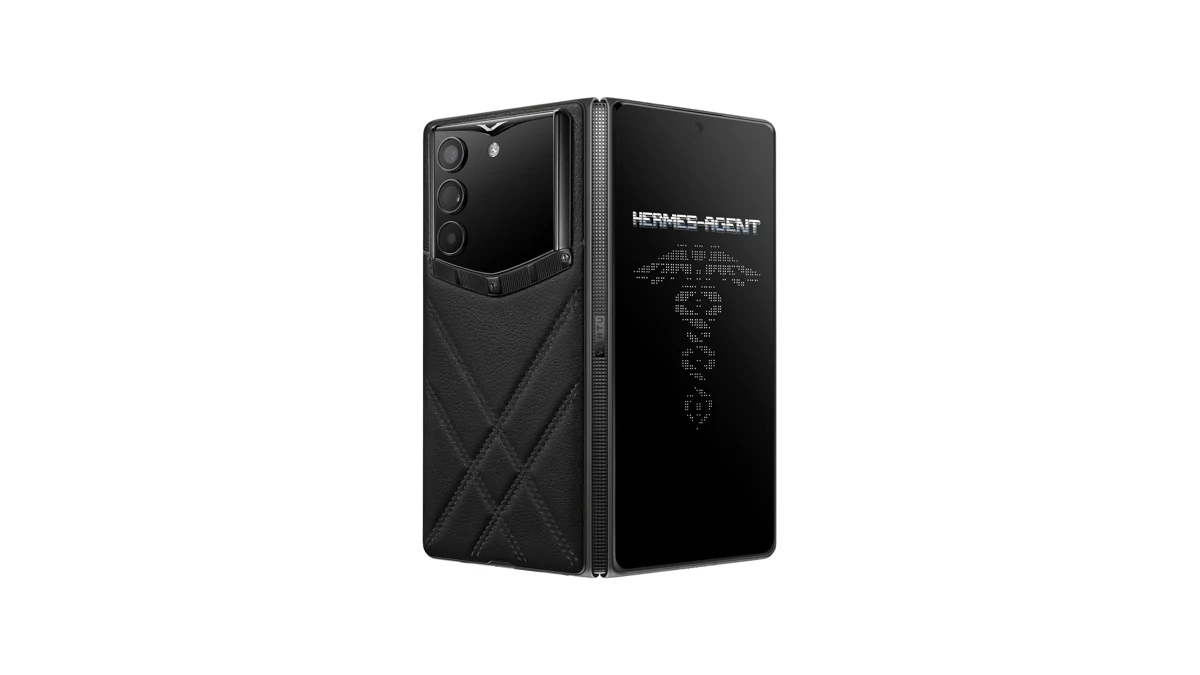 Vertu Alphafold phone closed, showing its black quilted leather back, triple camera and Hermes-Agent lettering