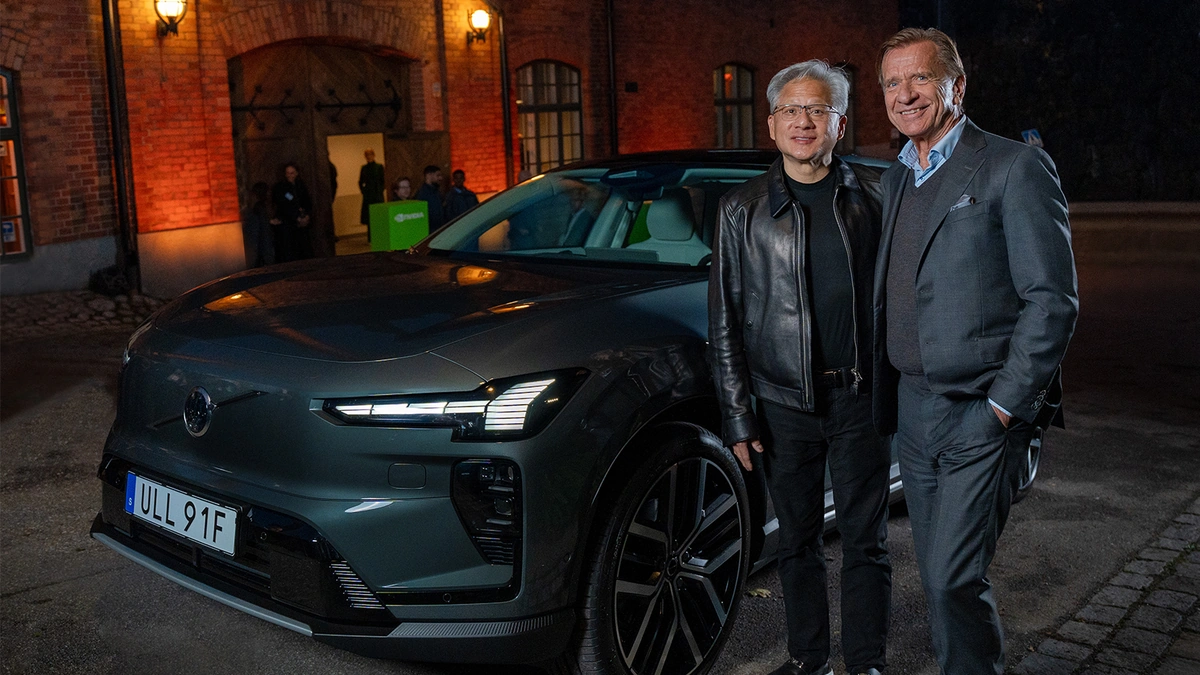 Volvo Cars and NVIDIA executives standing beside a dark Volvo electric SUV at night