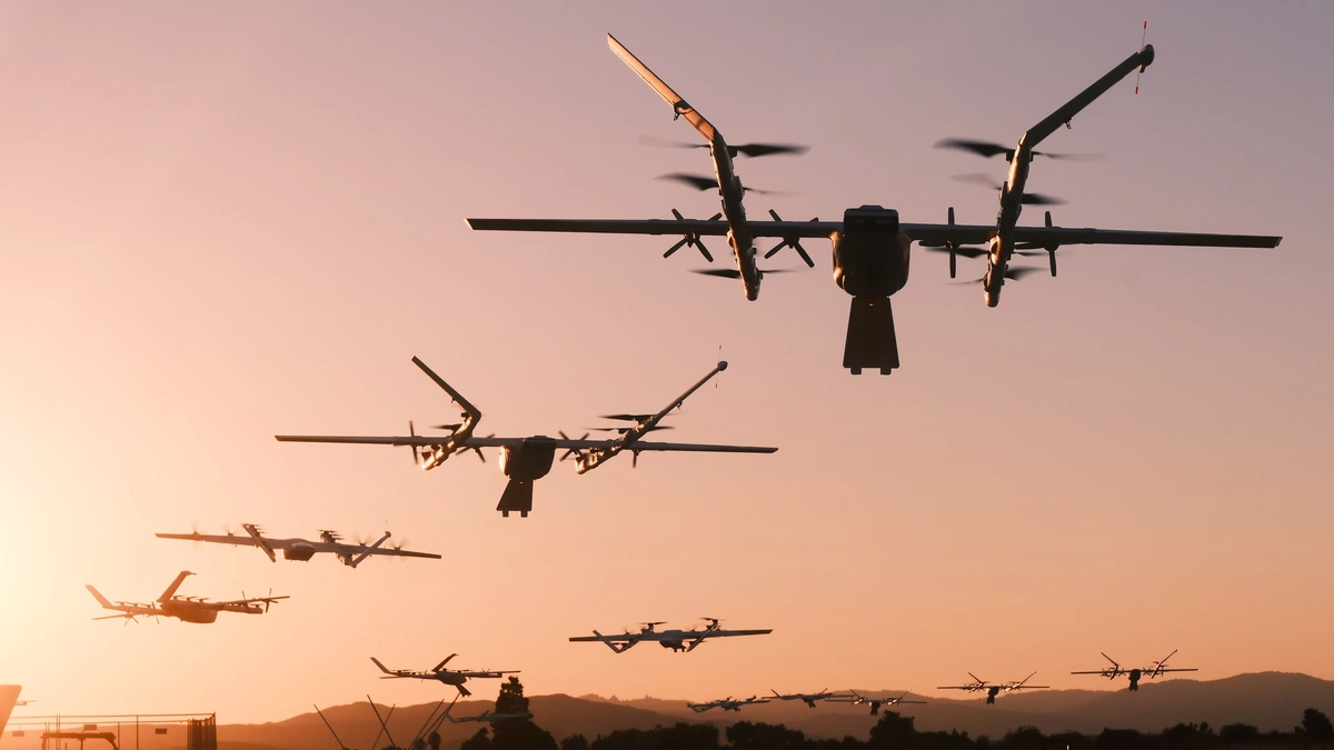 Several Wing delivery drones flying against an orange sunset sky above a ridge line