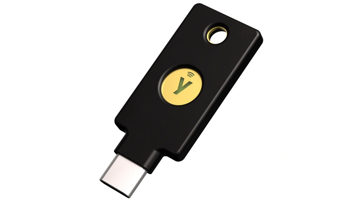 Yubico YubiKey 5C NFC hardware security key with a USB-C connector and gold touch sensor on a white background